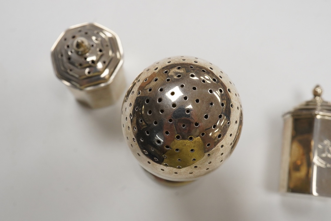 A George III provincial silver egg shaped pedestal pepperette, by Christian Ker Reid, Newcastle, circa, 1810, height 89mm, together with a pair of late Victorian octagonal pepperettes.